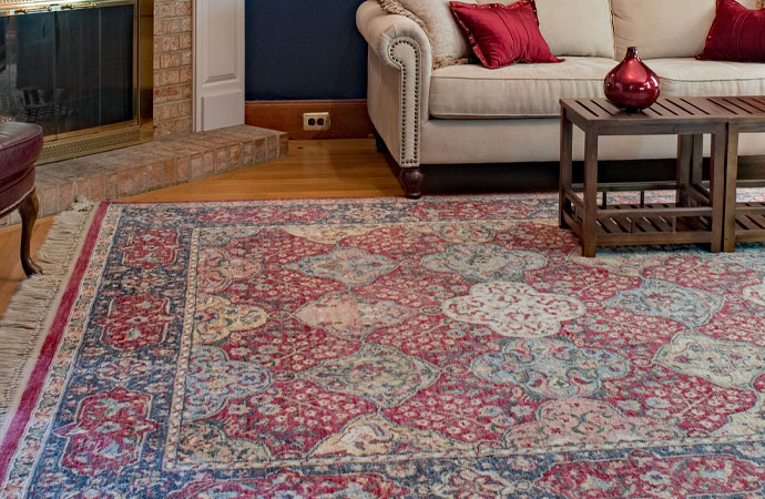Old Oriental rug in the living room, adding a touch of tradition and charm.