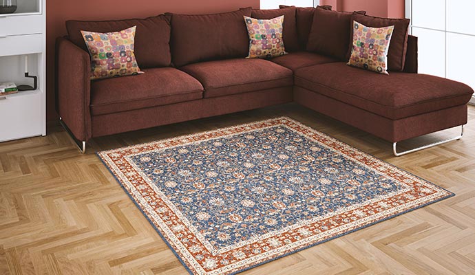 A traditional area rug placed on hardwood floor