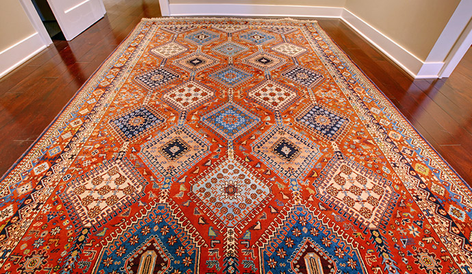 Antique Persian rug on hardwood floor