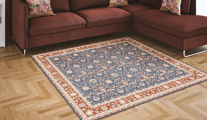 Antique-style oriental rug placed in a traditional living room