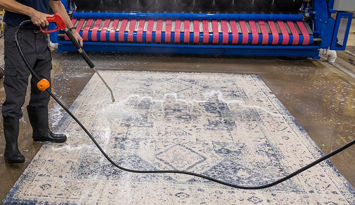 Professional rug cleaning with equipment