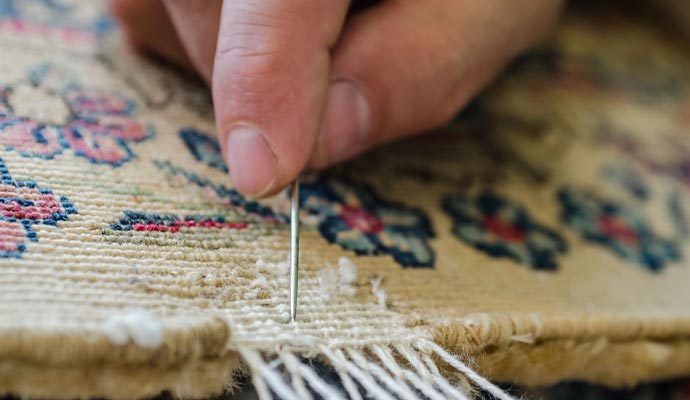 Hand stitching floral rug