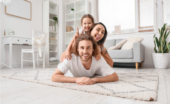 Happy family on the rug