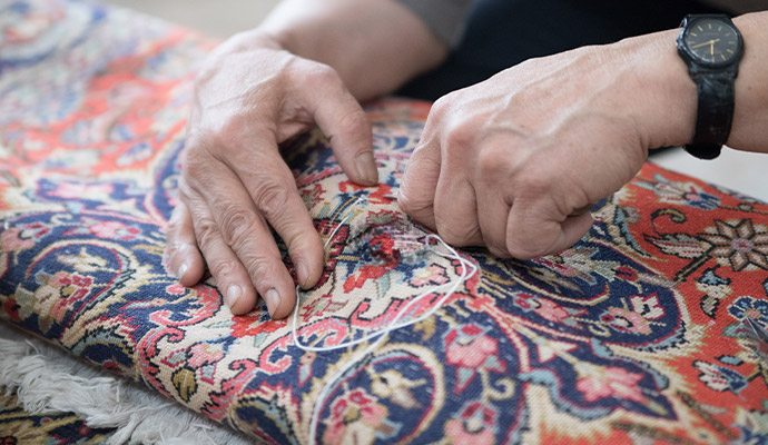 Professional rug repair hand stitching
