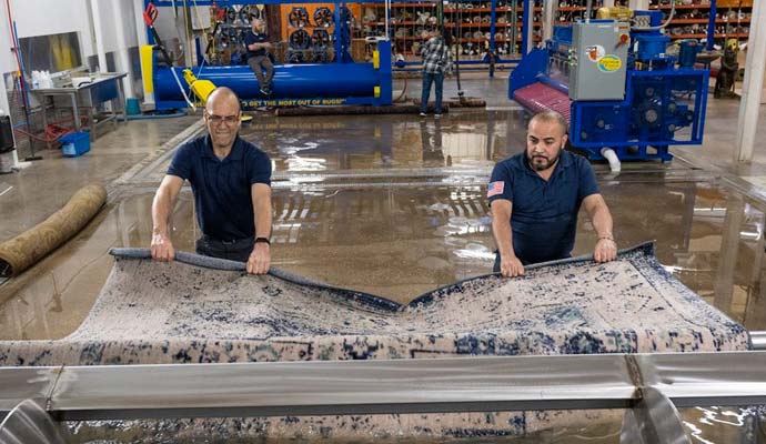 Professional rug cleaning process in an industrial facility