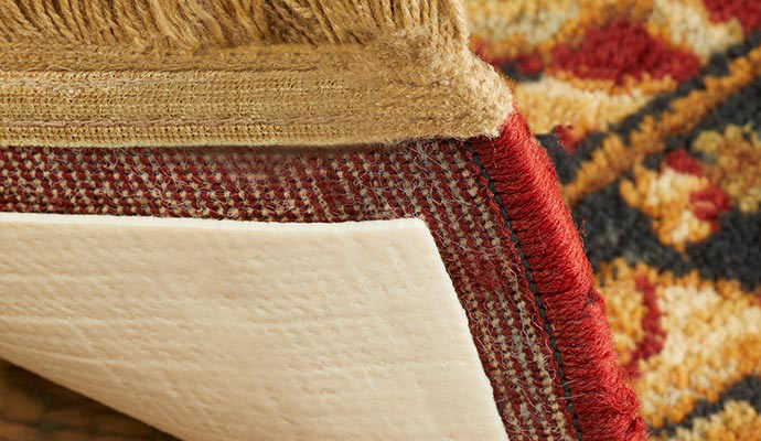 rug pad attached with rug on floor