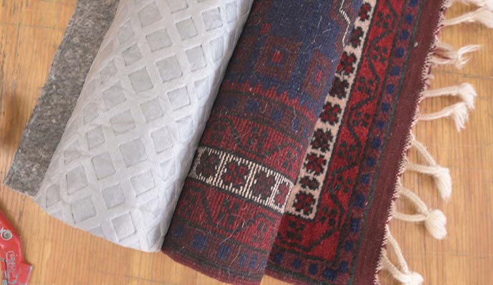 Rug pads on slick floors for better grip.