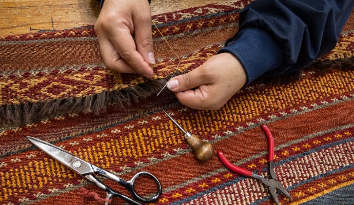 Oriental-rug hand reweaving repair