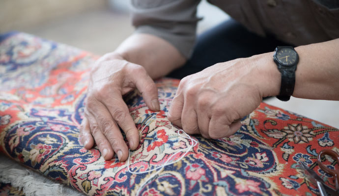 a professional patching a rug